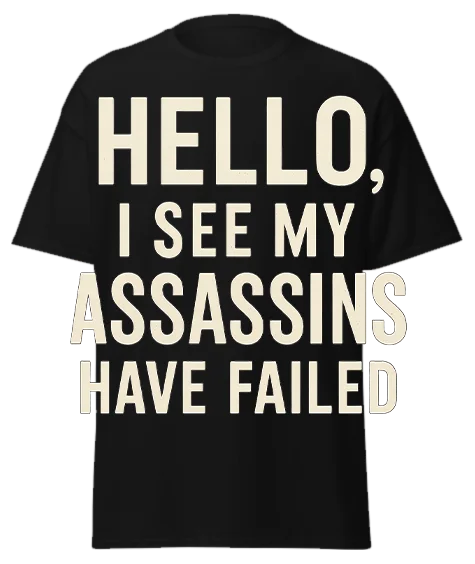 Black unisex t-shirt with off-white text reading "HELLO, I SEE MY ASSASSINS HAVE FAILED" – funny sarcastic graphic tee