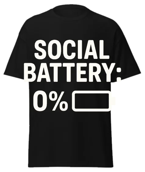 Black unisex t-shirt with off-white text reading "SOCIAL BATTERY: 0%" and empty battery icon – funny sarcastic graphic tee